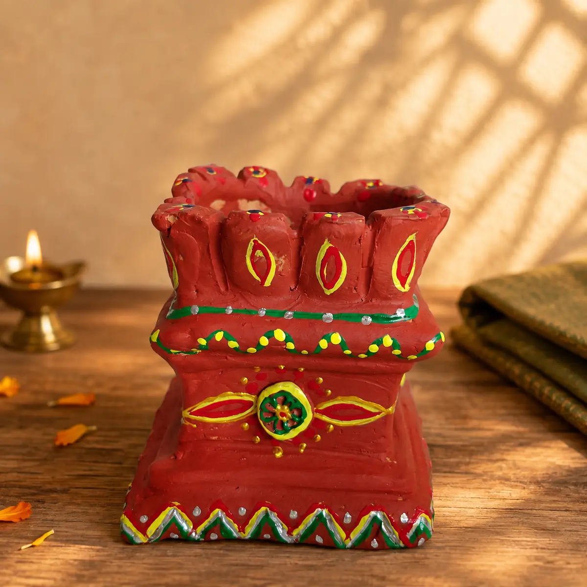 Traditional temple-style terracotta planter in a sunlit setting